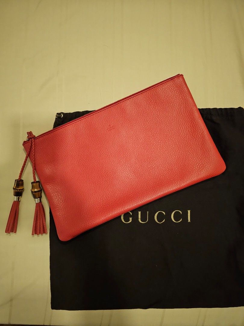 Gucci solid leather clutch with Bamboo tassel detail Women s
