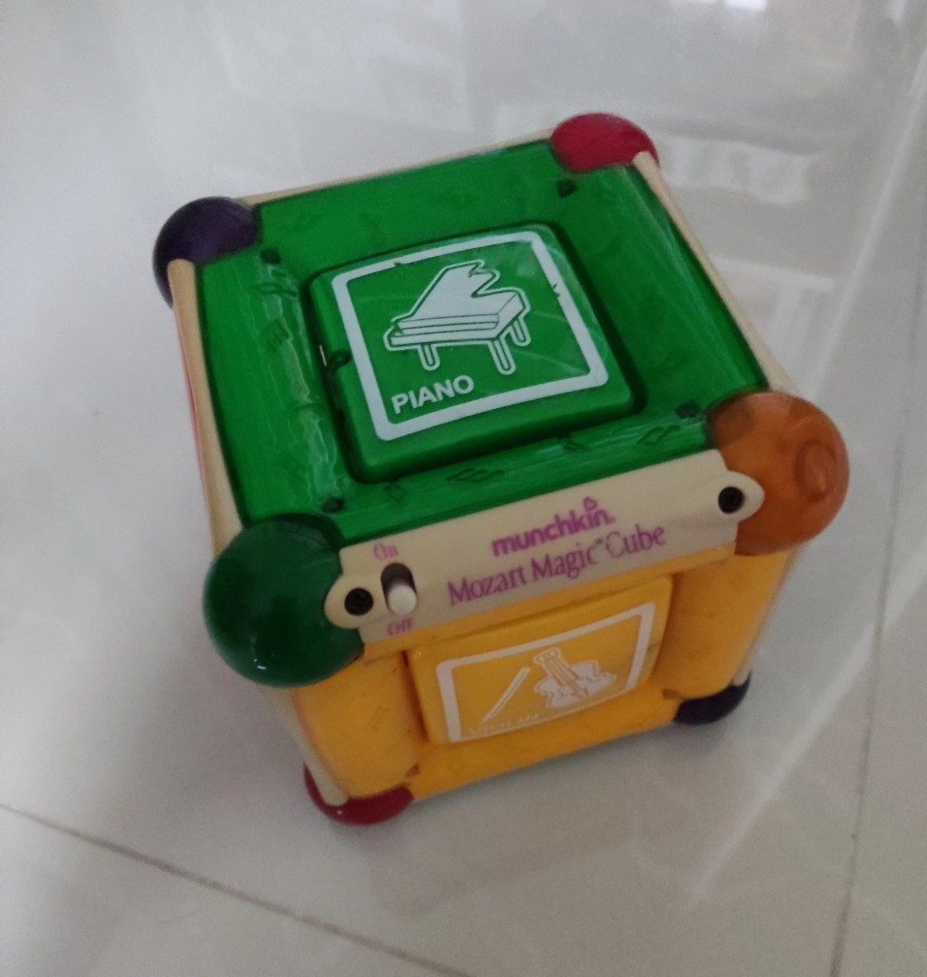 Exchange] Munchkin Mozart Magic Cube Lights Orchestra Music Development  Toy, Babies & Kids, Infant Playtime on Carousell