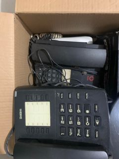 Old telephones, modem, and power plugs (take all)