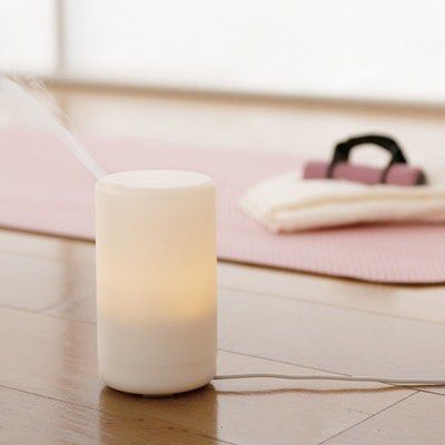 Aroma Diffuser (Category: Home Fragrance) located in Singapore. Submitted by vinniewonka (Listing ID 1277637859, Image 3). Description: retail price: $89 Comes with two free muji diffuser ( slightly used) The Aroma Diffuser uses ultrasonic waves to vaporise water and the essential oil in the tank to produce a cool, dry, fragrant mist. The white cylinder also houses a lamp that shines with an ambient glow and has 2 light settings. It’s flame free 