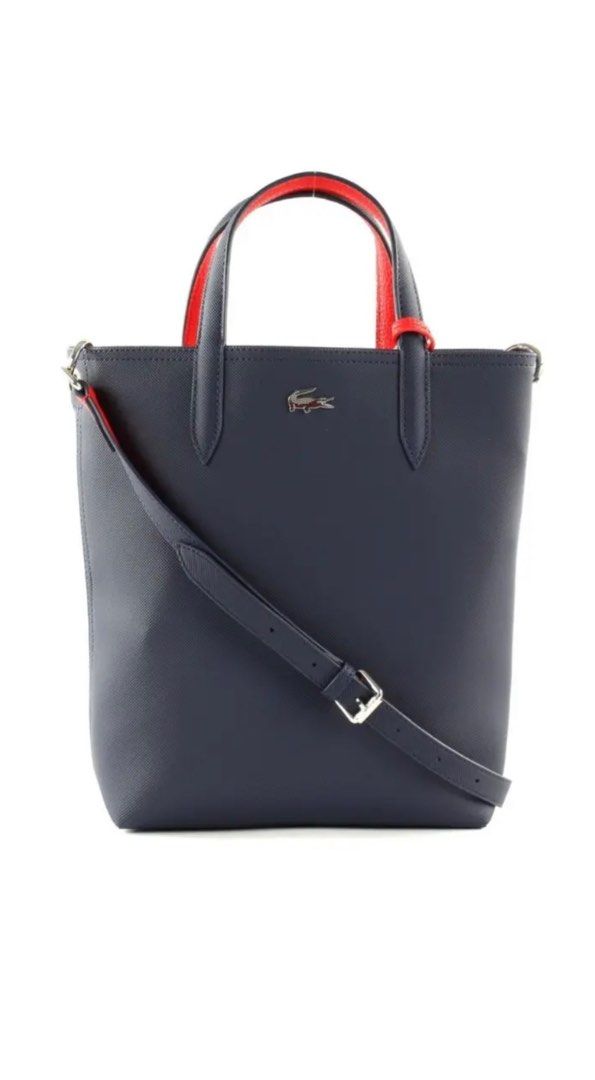 Lacoste reversible bag (Category: Bags & Wallets) located in Singapore. Submitted by wellnessnhealth (Listing ID 1277858952, Image 3). Description: Use a few Times, find the bag too small for me Height 11.0 inches (28 cm) x Width (Top 11.0 inches (28 cm) x Bottom 8.7 inches (22 cm)) x Depth 3 No pockets Weight: 12.2 oz (360 Handle Length: 11.0 inches (28 cm) Comes with a shoulder strap (total length 42.9 inches (1;Accessory Pouch: Height 7.1 inch
