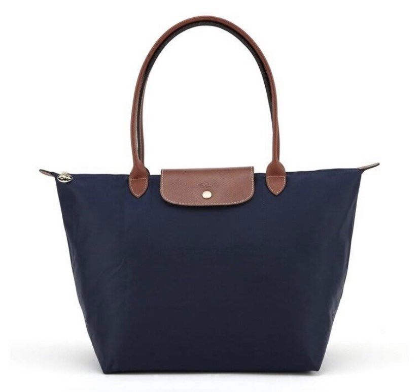 AUTHENTIC- Longchamp Le Pliage (Category: Luxury Bags & Wallets) located in Cabanatuan. Submitted by boo_121994 (Listing ID 1277995172, Image 3). Description: PreLoved - Authentic Longchamp Le Pliage Navy Blue in Small size. (Long hande) Bought it pre-order abroad. (Made in Paris) Rfs: Decluttering. Manage your expectation as it has been used, but not abused. Still presentable. *issue: last photos. *Note: This item is not Ukay. This is my persona