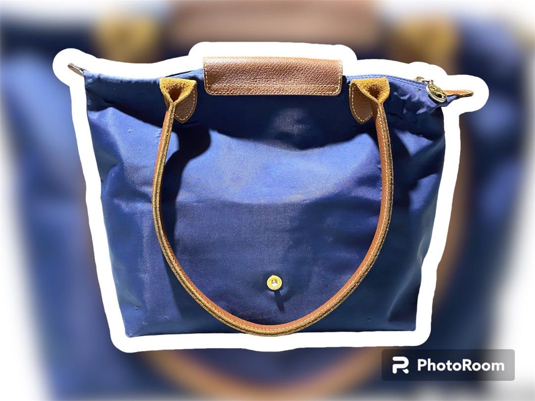 AUTHENTIC- Longchamp Le Pliage (Category: Luxury Bags & Wallets) located in Cabanatuan. Submitted by boo_121994 (Listing ID 1277995172, Image 1). Description: PreLoved - Authentic Longchamp Le Pliage Navy Blue in Small size. (Long hande) Bought it pre-order abroad. (Made in Paris) Rfs: Decluttering. Manage your expectation as it has been used, but not abused. Still presentable. *issue: last photos. *Note: This item is not Ukay. This is my persona