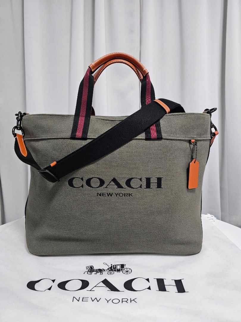 🧡Coach Men's Tote (Category: Luxury Bags & Wallets) located in Las Pinas. Submitted by mybagsfromthepast (Listing ID 1278004799, Image 1). Description: 100% Original Coach Men's Tote 38 in Olive Green Canvas and Leather Zip-top closure Front zipper pocket Inside multifunction pocket Comes with original dustbag and care card Like new Measurements (Approx) W:15" H: 13 1/2" D: 7" Handles with 6" drop Detachable strap with 21 3/4" drop for shoulder 