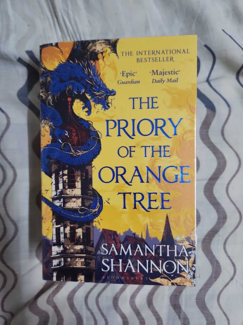 Book cover of The Priory of the Orange Tree by Samantha Shannon featuring intricate dragon imagery