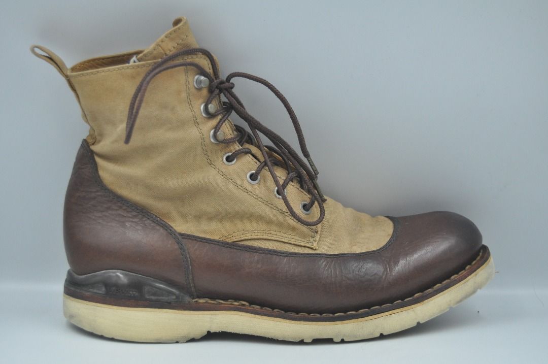 Visvim - F/W 11 - Veritus-Folk Boots (Category: Boots) located in Manila. Submitted by graymatter_ (Listing ID 1277951469, Image 2). Description: Visvim - F/W 11 - Veritus-Folk Boots Combining two complementary materials in leather and canvas, the new incoming style is yet another addition to visvim’s staggering collection of boots. A beige canvas upper sits atop a brown leather overlay with a signature external heel cup. Tagged Size: 9.5 Conditi