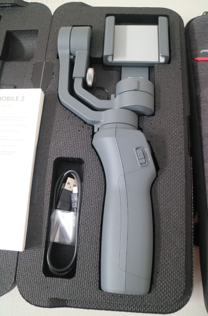 [Pre-Loved] DJI OSMO Mobile 2 (with box) (Category: Gimbals & Stabilizers ) located in Pasig City. Submitted by findingviolet (Listing ID 1328436326, Image 3). Description: [Pre-Loved] DJI OSMO Mobile 2 - The Osmo Mobile 2 is a handheld smartphone gimbal that helps you capture smooth, cinematic movement. Model: OM170 Condition: Like new with box, used with care RFS: seldom used, not really using it anymore For specs, you may check at https://www.