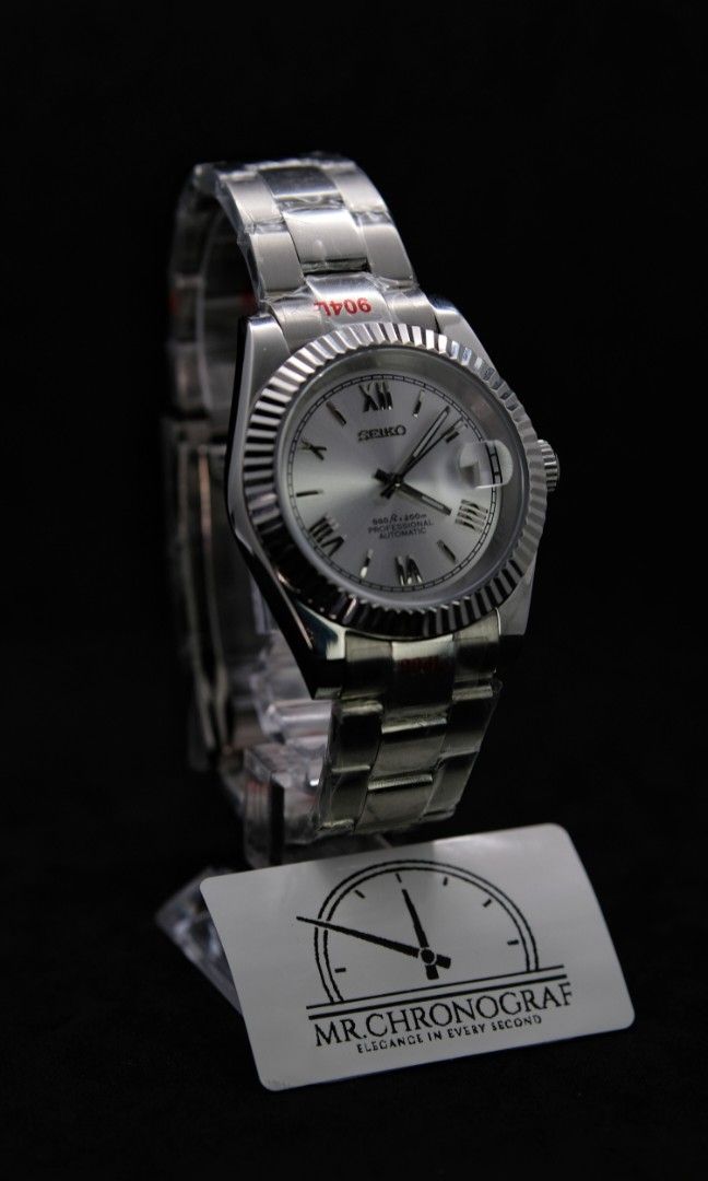 Seiko Mod Datejust Roman Silver (Category: Luxury Watches) located in Manila. Submitted by rafael_lesaguis (Listing ID 1328510270, Image 2). Description: BRANDNEW! Seiko Mod Datejust Roman Silver Movement: Seiko NH35 Automatic TMI version with winding and hacking feature Case and Strap: 39mm 904L Stainless Steel / Oyster Strap Dial: Seiko logo with roman markers on silver dial Glass: Sapphire scratch resistant Hands: Datejust hands Timegrapher ca