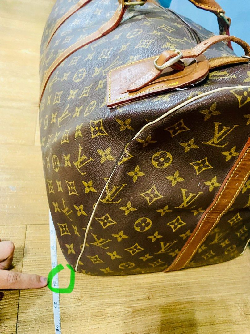 SALE!!! LV Large Duffel Bag (preloved) (Category: Luxury Bags & Wallets) located in Quezon City. Submitted by twelve_17 (Listing ID 1329819938, Image 3). Description: Original selling price 13,500 Has 3 damage holes in handle area but can be fixed in tailor shops for leather.
