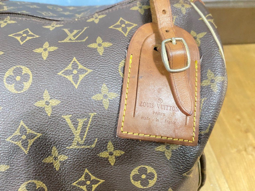 SALE!!! LV Large Duffel Bag (preloved) (Category: Luxury Bags & Wallets) located in Quezon City. Submitted by twelve_17 (Listing ID 1329819938, Image 2). Description: Original selling price 13,500 Has 3 damage holes in handle area but can be fixed in tailor shops for leather.