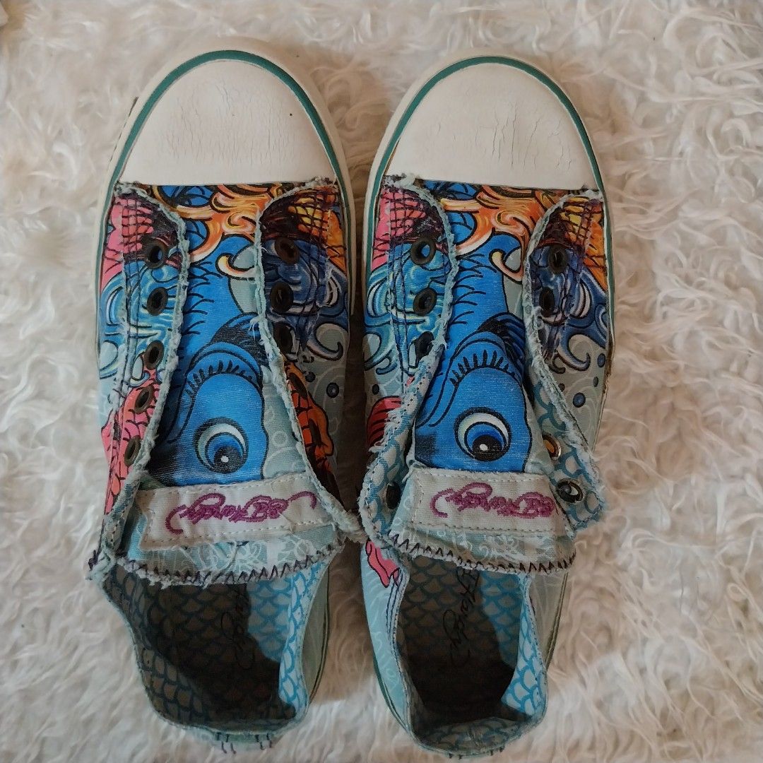 Original ED HARDY sneakers (Category: Sneakers & Footwear) located in Quezon City. Submitted by mgrc08 (Listing ID 1330109048, Image 1). Description: vintage look sneakers very comfy well used but maintained except for the cracked rubber upfront but it can go with the look.
