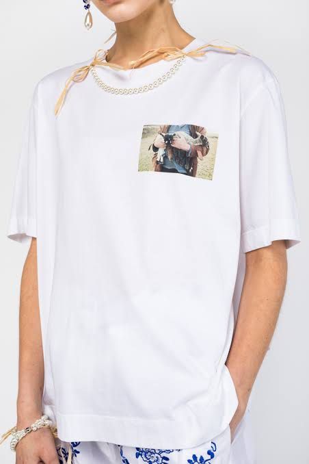 SIMONE ROCHA SHEEP PRINT LOGO WHITE SHIRT (Category: Shirts) located in Manila. Submitted by revise.ph_ (Listing ID 1330143699, Image 1). Description: SIMONE ROCHA SHEEP PRINT LOGO WHITE SHIRT Made in PORTUGAL Tagged Size: SMALL Dimensions Length:25.8 Width:19.5 Shoulder:17.5 Sleeve:9.4 issue: MISSING BEADS CHECK REFERENCE PHOTOS &FIRST PHOTO Price:1,500 Free Shipping via JNT.