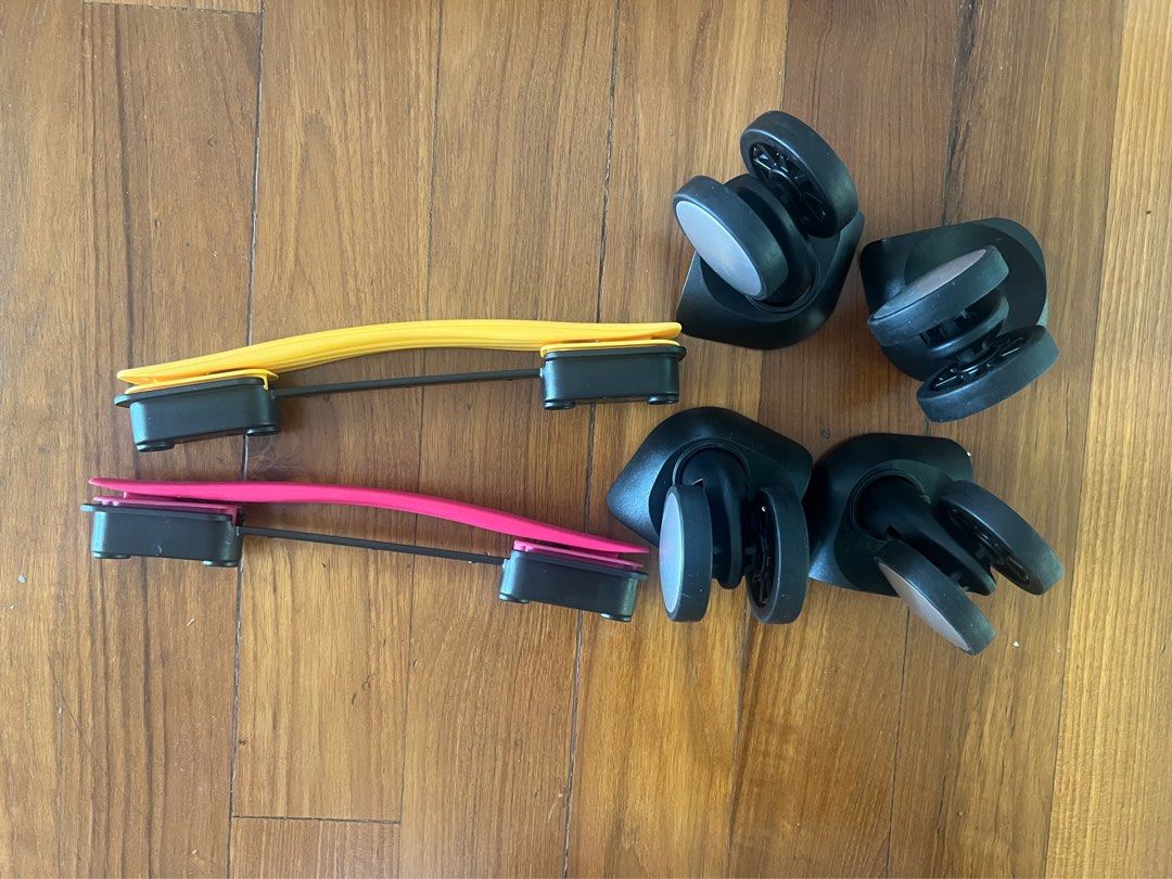 Spare parts Curio. American Tourister luggage. Wheels and handles. Pink and yellow Hobbies Toys Travel Luggage on Carousell