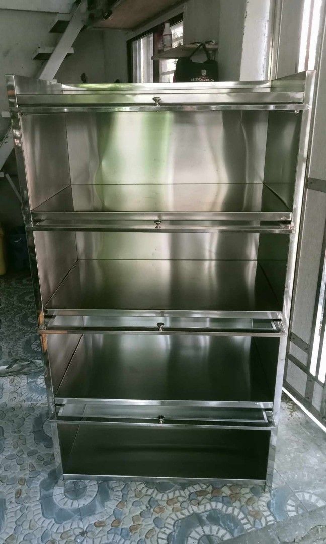 Stainless Kitchen cabinet (Category: Food Organization & Storage) located in Manila. Submitted by gregson14778945 (Listing ID 1330332832, Image 1). Description: stainless kitchen cabinet with glass door elegant and rust safe easy to clean.