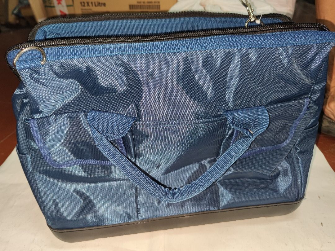 Tool Bag (Category: Construction Tools & Equipment) located in Manila. Submitted by kingkai999 (Listing ID 1330304421, Image 2). Description: A tool bag is a durable, often portable container used for storing and organizing various tools and equipment. It typically features multiple compartments, pockets, and dividers to keep tools neatly organized and easily accessible for different tasks. Tool bags come in various sizes, materials, and designs 