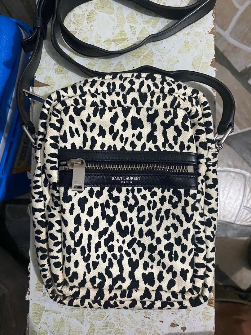 YVES SAINT LAURENT White/Black Leopard Print Canvas Sid Messenger Bag (Category: Luxury Bags & Wallets) located in Bacolod City. Submitted by novymae23 (Listing ID 1330289822, Image 1). Description: 100% original authentic legit Saint Laurent Crossbody Bag From the 2020 Collection by Anthony Vaccarello Neutrals Canvas Animal Print Silver-Tone Hardware Leather Trim Single Adjustable Shoulder Strap Leather Trim Embellishment & Single Exterior Pocke
