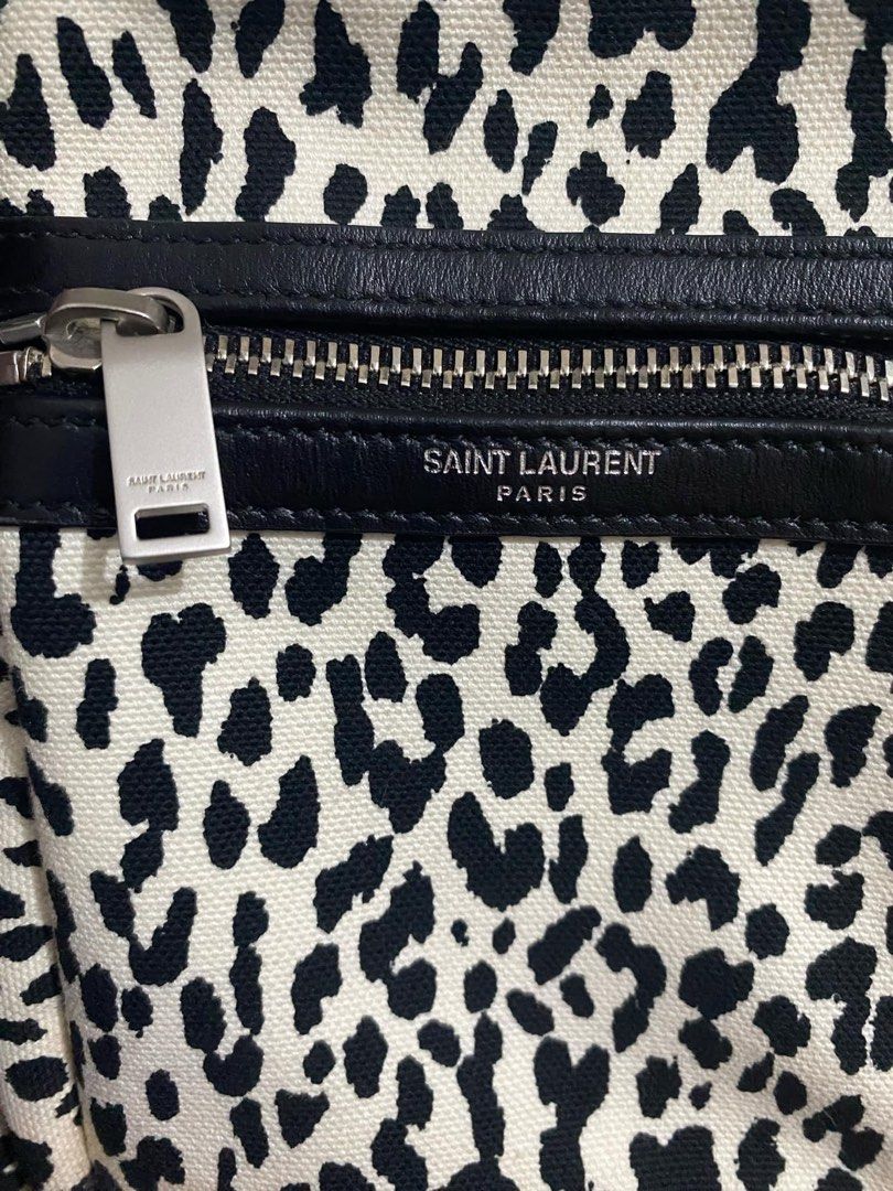YVES SAINT LAURENT White/Black Leopard Print Canvas Sid Messenger Bag (Category: Luxury Bags & Wallets) located in Bacolod City. Submitted by novymae23 (Listing ID 1330289822, Image 3). Description: 100% original authentic legit Saint Laurent Crossbody Bag From the 2020 Collection by Anthony Vaccarello Neutrals Canvas Animal Print Silver-Tone Hardware Leather Trim Single Adjustable Shoulder Strap Leather Trim Embellishment & Single Exterior Pocke