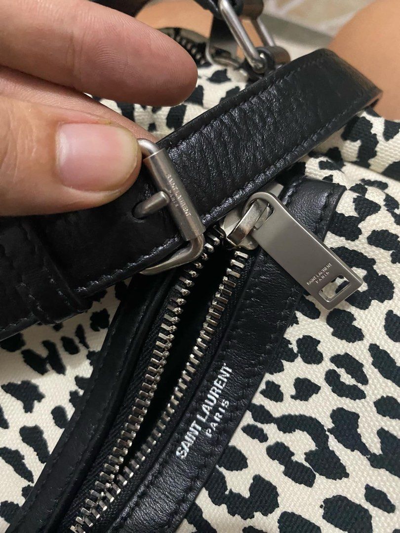 YVES SAINT LAURENT White/Black Leopard Print Canvas Sid Messenger Bag (Category: Luxury Bags & Wallets) located in Bacolod City. Submitted by novymae23 (Listing ID 1330289822, Image 2). Description: 100% original authentic legit Saint Laurent Crossbody Bag From the 2020 Collection by Anthony Vaccarello Neutrals Canvas Animal Print Silver-Tone Hardware Leather Trim Single Adjustable Shoulder Strap Leather Trim Embellishment & Single Exterior Pocke