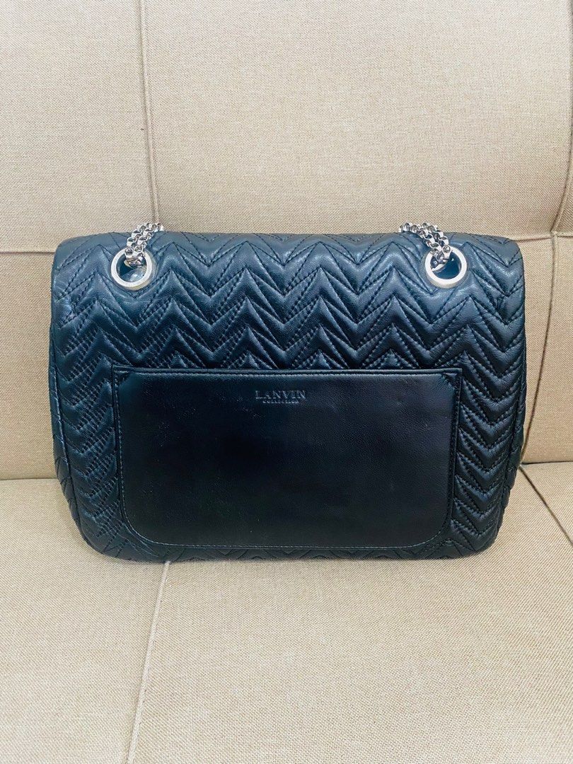 Authentic/ Pre-owned LANVIN Leather Flap Bag (Category: Luxury Bags & Wallets) located in Lucena. Submitted by madame_bagelia_collection (Listing ID 1330369126, Image 2). Description: Authentic & Preloved Rank B , lightly used but looks new Metal chain strap, convertible to shoulder & crossbody. Silver tone hardware Medium size (Practical size) Dimensions: Length 29cm, Height 22cm, Width 8cm Free Shipping 🎁🚛.