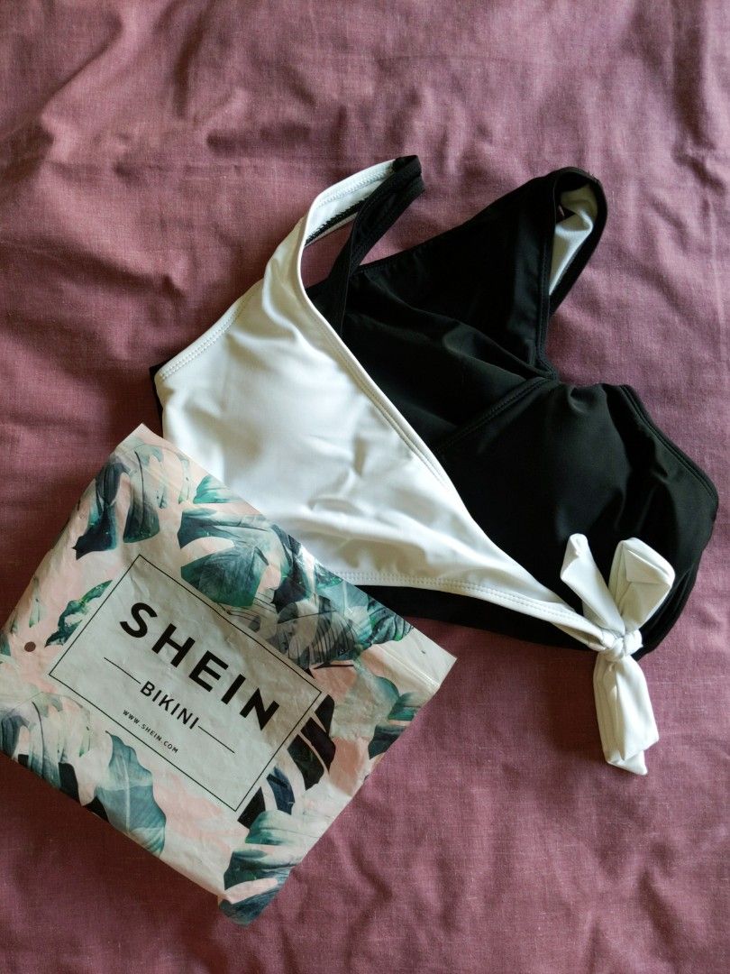 Classy black and white swimsuit (Category: Bikinis & Swimsuits) located in Mandaluyong City. Submitted by clf97 (Listing ID 1330346289, Image 3). Description: One-piece bathing suit. Bought online years ago, didn't like the high leg. Didn't really use it..