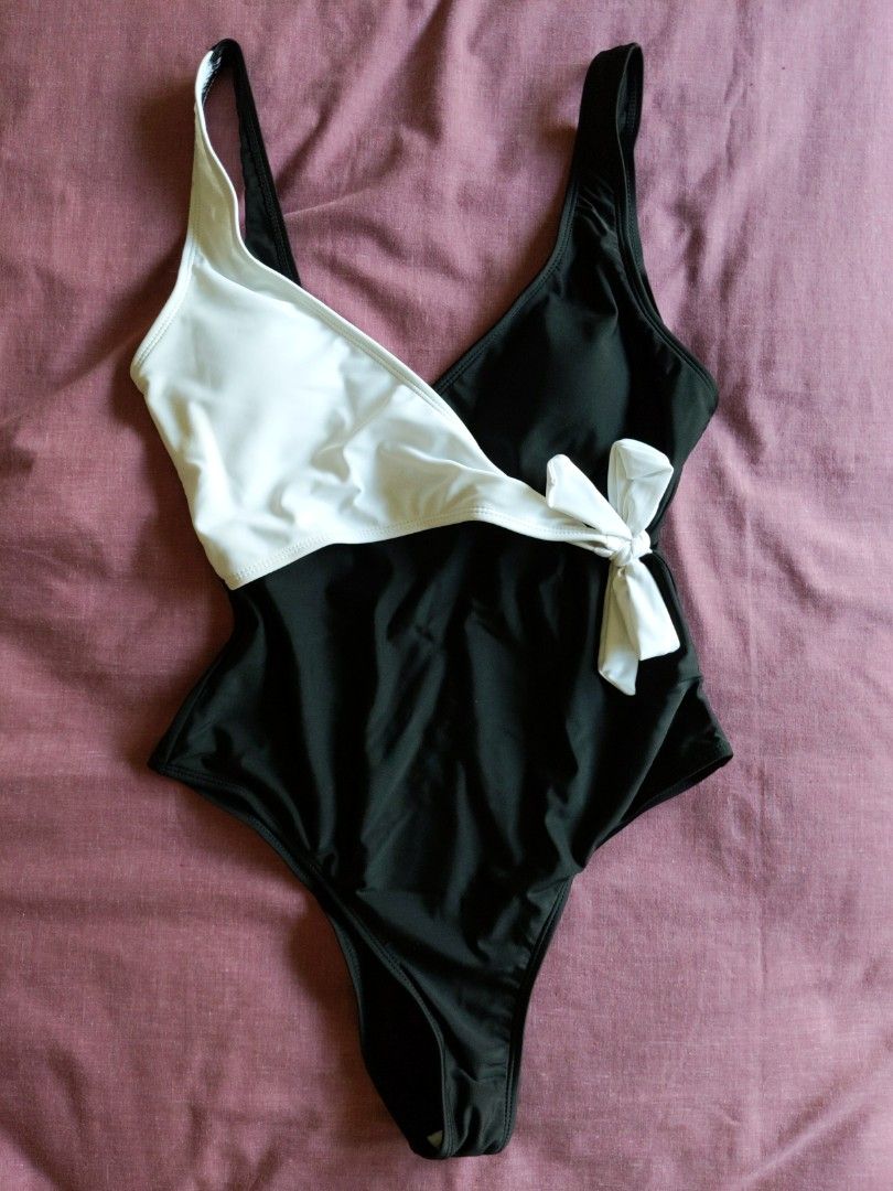 Classy black and white swimsuit (Category: Bikinis & Swimsuits) located in Mandaluyong City. Submitted by clf97 (Listing ID 1330346289, Image 1). Description: One-piece bathing suit. Bought online years ago, didn't like the high leg. Didn't really use it..