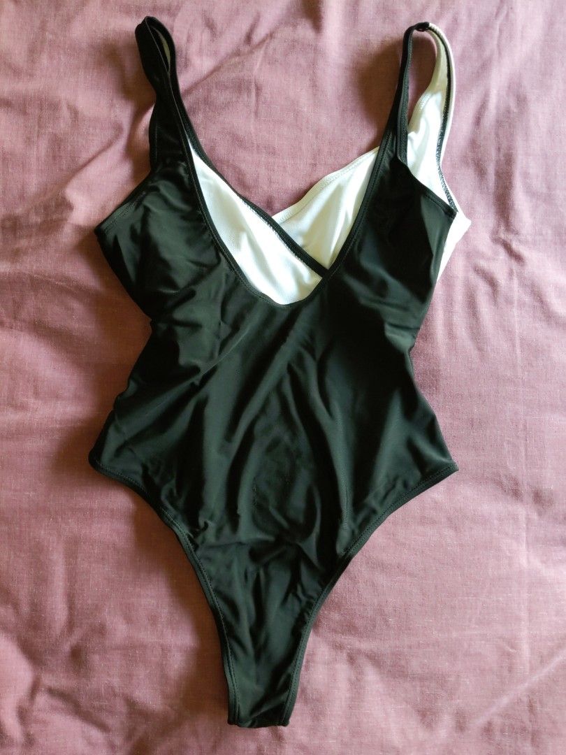 Classy black and white swimsuit (Category: Bikinis & Swimsuits) located in Mandaluyong City. Submitted by clf97 (Listing ID 1330346289, Image 2). Description: One-piece bathing suit. Bought online years ago, didn't like the high leg. Didn't really use it..