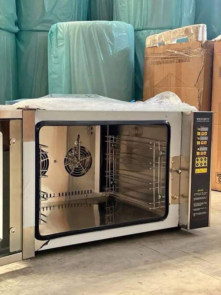 COMMERCIAL CONVECTION OVEN WITH 4 PANS (Category: Ovens & Toasters) located in Taguig. Submitted by mgracelim38484 (Listing ID 1330366013, Image 3). Description: SPECIFICATIONS: -4 Pan tray included -Intelligent hot air circulation furnace -Double fan -Power: 4200W -Voltage: 220v -Net weight: 58Kg -Dimensions: 710*605*510 (mm) -Thick stainless steel -Warming faster -Heat evenly -Transparent glass window -Handle anti-scald -Timing and temperature 
