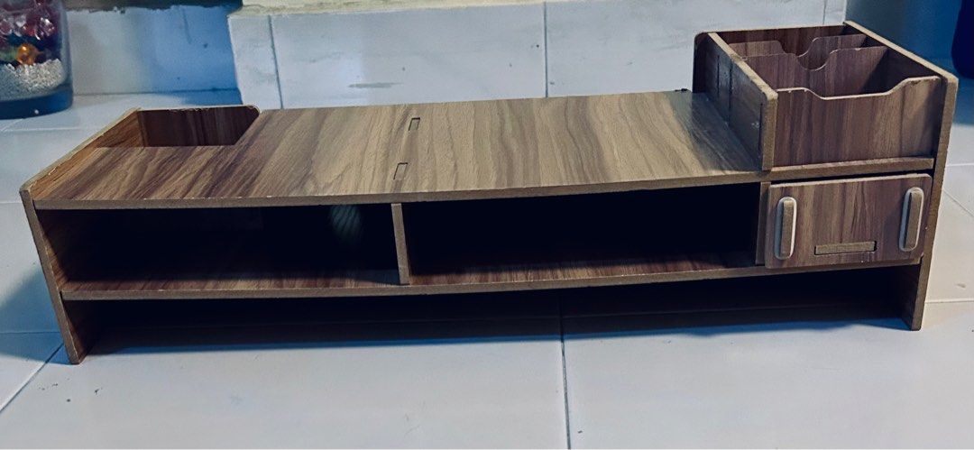 Computer Riser / Stand / Shelf (Category: Shelves, Cabinets & Racks) located in Singapore. Submitted by surfberry (Listing ID 1330401426, Image 3). Description: H 5.5 inches x L 8 inches Study With compartments & drawer Selling to clear space. In good condition. No low ballers pls! .