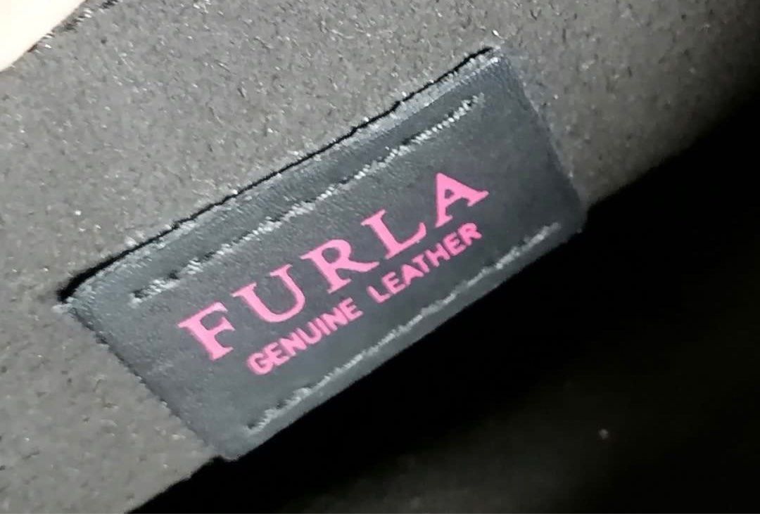 Furla black bag (Category: Luxury Bags & Wallets) located in Quezon City. Submitted by skoom (Listing ID 1330353882, Image 2). Description: Has signs of usage but still beautiful and functional. Last price.