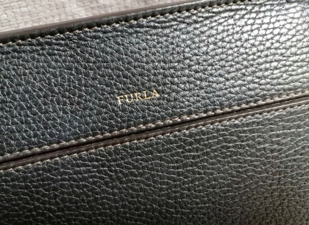 Furla black bag (Category: Luxury Bags & Wallets) located in Quezon City. Submitted by skoom (Listing ID 1330353882, Image 3). Description: Has signs of usage but still beautiful and functional. Last price.