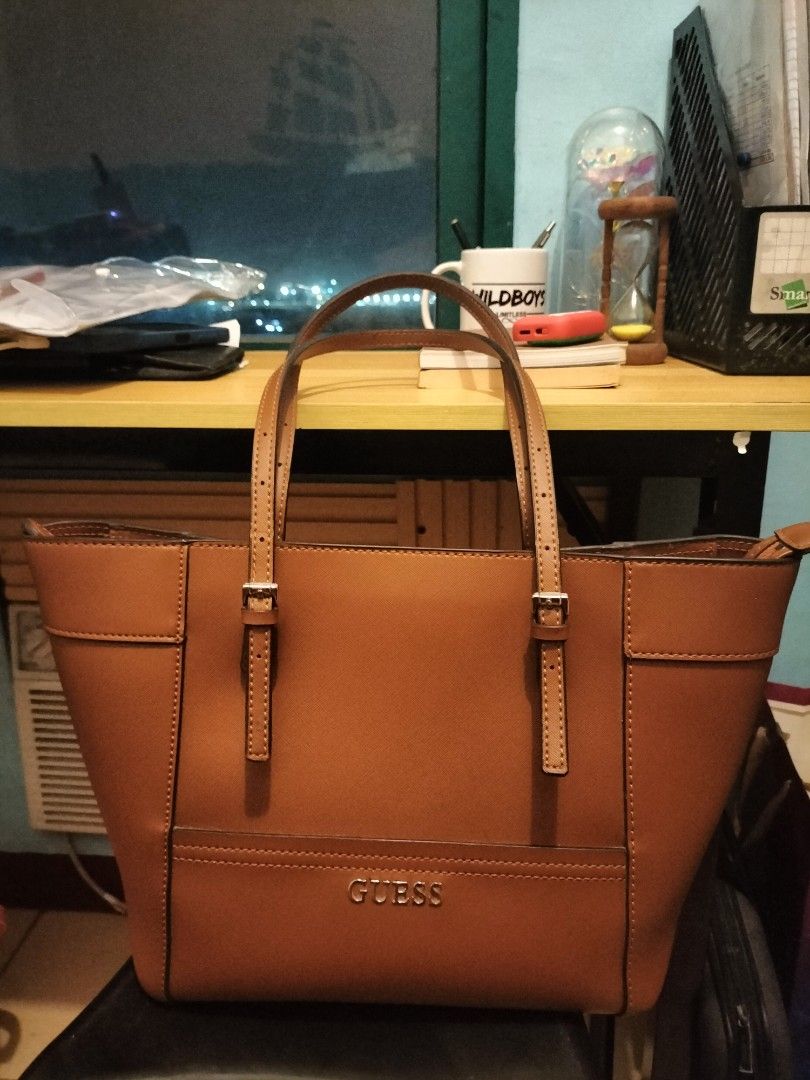 Guess Brown Tote (Category: Tote Bags) located in Paranaque City. Submitted by surfacedesign (Listing ID 1330504449, Image 3). Description: Authentic Guess Tote. Used once. Selling the bag because I am getting a smaller bag. My location is in Manila. PM if interested. Shipping shouldered by buyer.