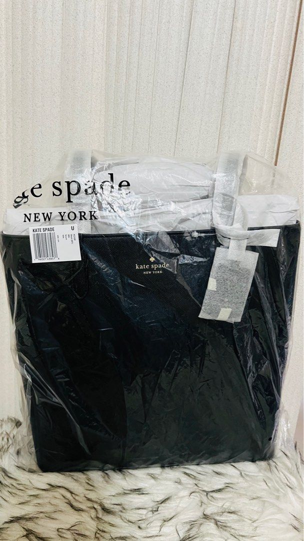 Kate Spade Brynn Tote (Black) (Category: Tote Bags) located in Cavite. Submitted by everythingnicehere (Listing ID 1330398245, Image 3). Description: ✅ Genuine original 💯 imported from Canada 🇨🇦 ✅ On hand 🇵🇭; ready to ship Measurements: 4.0" x 12.0" 12"W (Bottom), 13.36"W (Top) Materials: Saffiano PVC Two way script logo lining Handle Drop: 11.00" Features: Interior front slip pocket Drop in top zip closure Foil embossed logo NOTE: Payment f