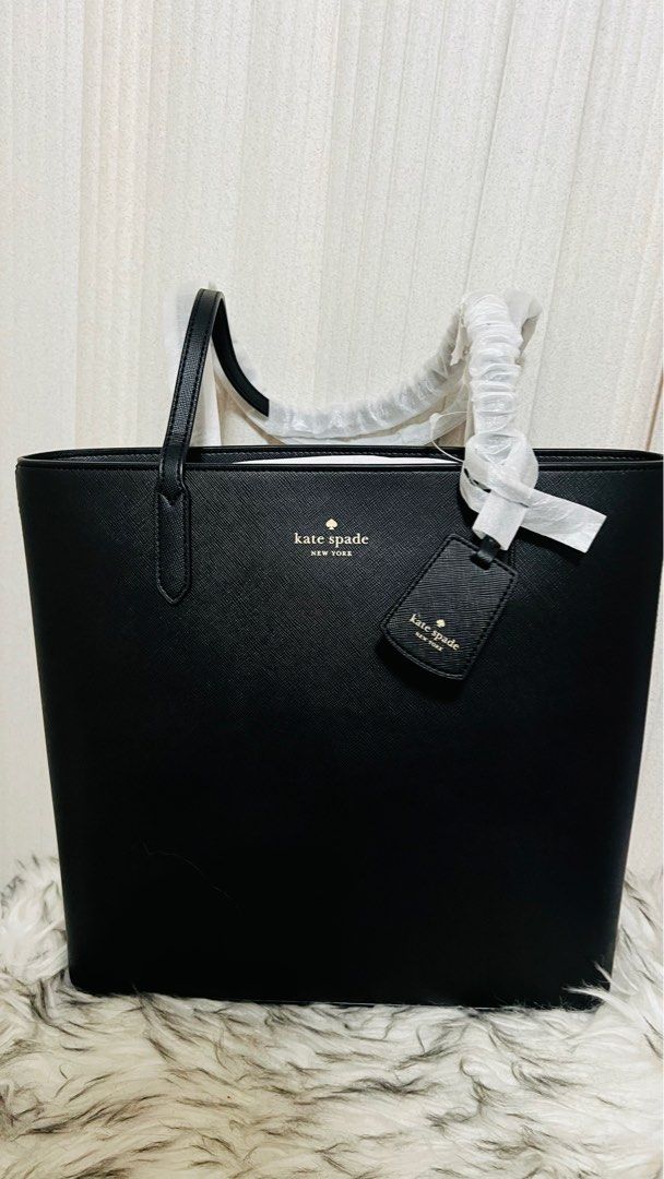 Kate Spade Brynn Tote (Black) (Category: Tote Bags) located in Cavite. Submitted by everythingnicehere (Listing ID 1330398245, Image 1). Description: ✅ Genuine original 💯 imported from Canada 🇨🇦 ✅ On hand 🇵🇭; ready to ship Measurements: 4.0" x 12.0" 12"W (Bottom), 13.36"W (Top) Materials: Saffiano PVC Two way script logo lining Handle Drop: 11.00" Features: Interior front slip pocket Drop in top zip closure Foil embossed logo NOTE: Payment f