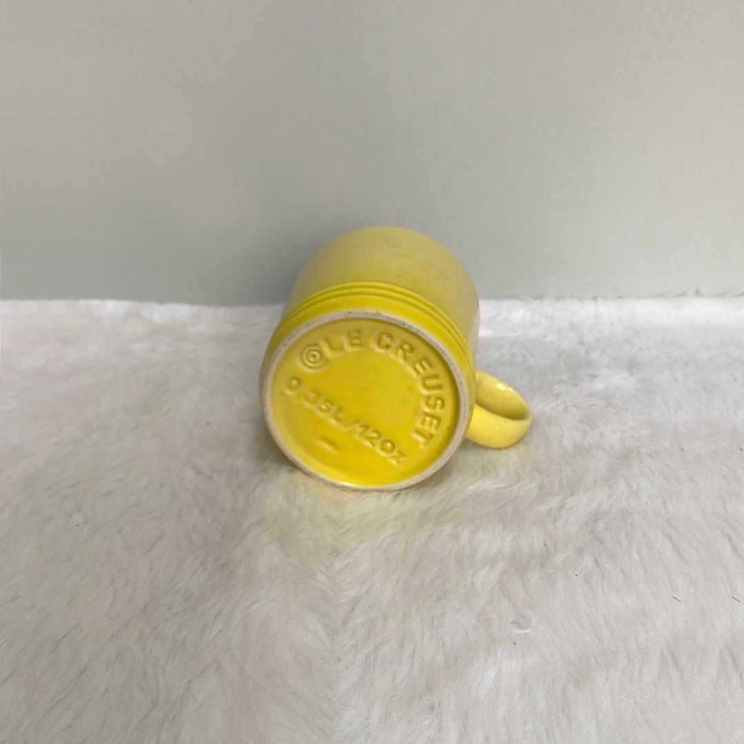 Le Creuset Yellow Stoneware Cup Mug (Category: Coffee & Tea Tableware) located in Consolacion. Submitted by posh_avenue_home (Listing ID 1330357266, Image 3). Description: In very good condition. From Japan. 3.75" x 3.5"..