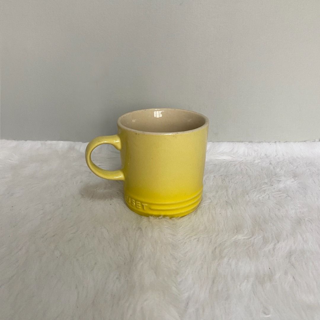 Le Creuset Yellow Stoneware Cup Mug (Category: Coffee & Tea Tableware) located in Consolacion. Submitted by posh_avenue_home (Listing ID 1330357266, Image 1). Description: In very good condition. From Japan. 3.75" x 3.5"..