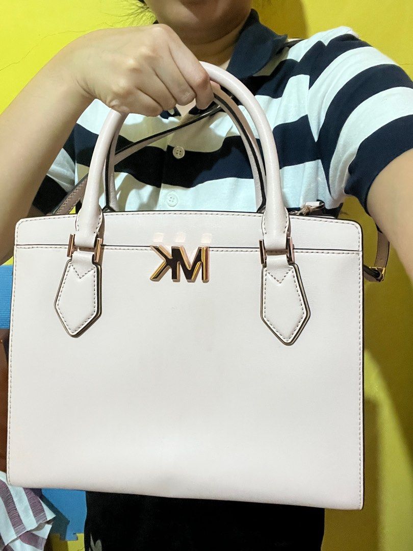 Michael Kors (Category: Luxury Bags & Wallets) located in Ilagan. Submitted by marianeangelica (Listing ID 1330451963, Image 3). Description: Mk blush pink bag with sling. Used once or twice only for church Rfs: naka stock nalang po sa closet Sf will be shouldered by buyer.