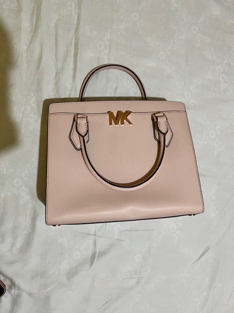 Michael Kors (Category: Luxury Bags & Wallets) located in Ilagan. Submitted by marianeangelica (Listing ID 1330451963, Image 1). Description: Mk blush pink bag with sling. Used once or twice only for church Rfs: naka stock nalang po sa closet Sf will be shouldered by buyer.