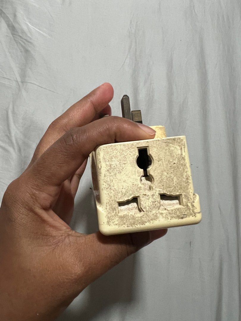 Multi extension plug (Category: Other Accessories) located in Singapore. Submitted by pettycloset (Listing ID 1330348010, Image 3). Description: Discolouration from storage. Works well (tested 12 oct 2024). .
