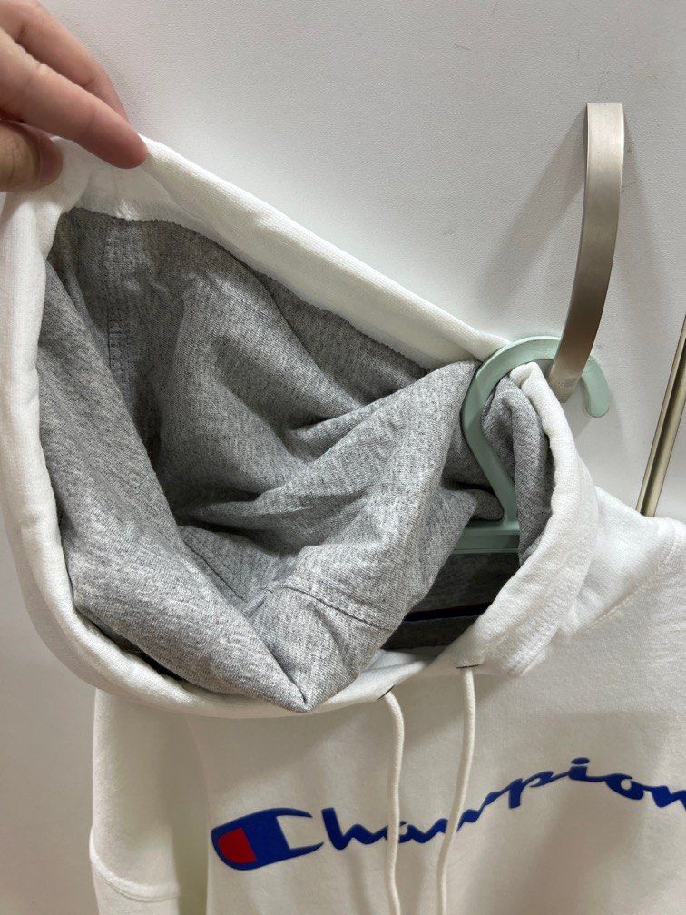 White Champion Hoodie (Category: Coats, Jackets and Outerwear) located in Manila. Submitted by ooks_ (Listing ID 1330436695, Image 2). Description: White Champion Hoodie from the US - Never worn, just stored. - US Medium, but can fit an Asian Large IMO. - No flaws, really good condition..