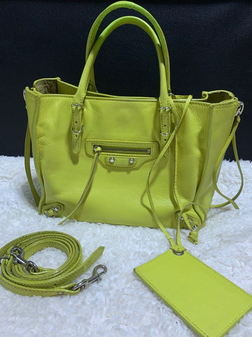 Authentic Balenciaga Papier A4 Mini Bag (Category: Luxury Bags & Wallets) located in Rosario. Submitted by myvinatgepieces (Listing ID 1330635602, Image 2). Description: Authentic Balenciaga Papier A4 Mini Shoulder Bag Normal signs of wear Body- very good used condition Handles- cracks- undergone color restoration by professional bag restoration shop Measurements: 9” L x 3.5” W x 7” H Interior Pockets: One patch pocket Exterior Pockets: One front