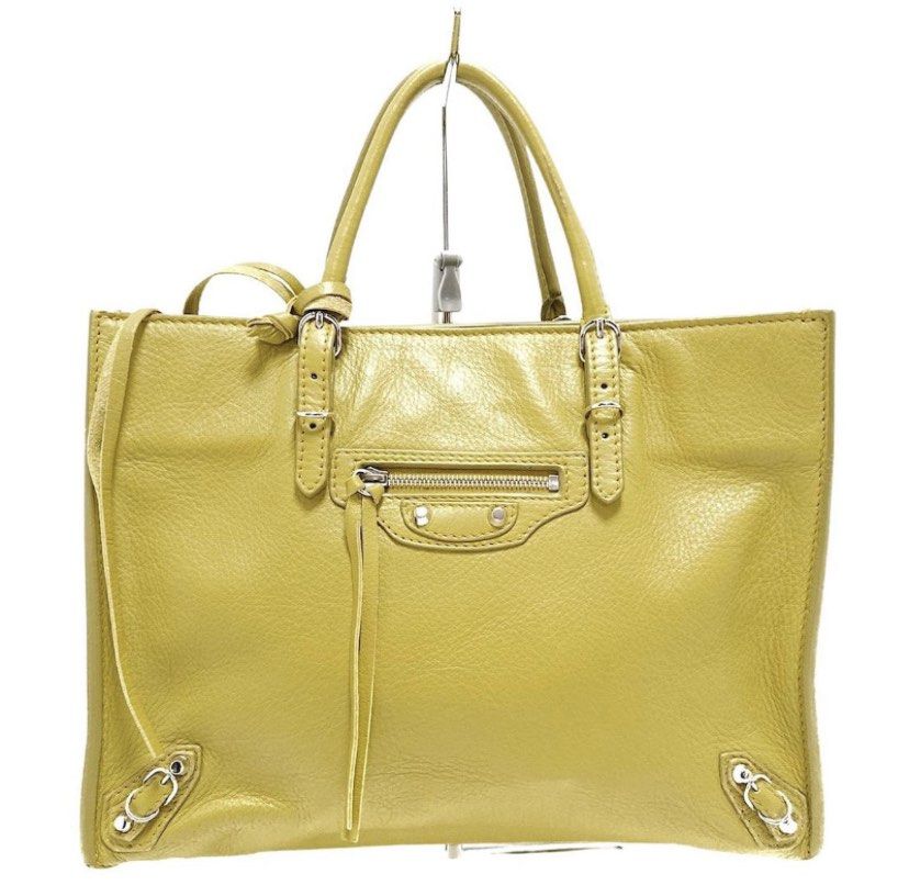 Authentic Balenciaga Papier A4 Mini Bag (Category: Luxury Bags & Wallets) located in Rosario. Submitted by myvinatgepieces (Listing ID 1330635602, Image 1). Description: Authentic Balenciaga Papier A4 Mini Shoulder Bag Normal signs of wear Body- very good used condition Handles- cracks- undergone color restoration by professional bag restoration shop Measurements: 9” L x 3.5” W x 7” H Interior Pockets: One patch pocket Exterior Pockets: One front