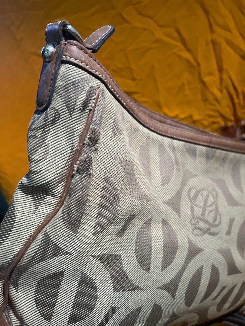 Louis Quatorze 2 way bag (Category: Luxury Bags & Wallets) located in Pasay City. Submitted by damoreluxe (Listing ID 1330622523, Image 3). Description: Louis Quatorze 2 way bag Have rubs as shown on the pictures. Tarnished hardware but does affect the use of this bag..