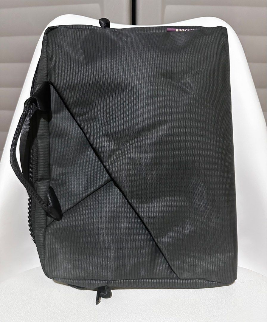 Rivacase 8720 Grey Laptop Bag (Category: Laptop Bags & Sleeves) located in Manila. Submitted by classictrends_24 (Listing ID 1330646259, Image 2). Description: - Ultra slim, compact bag that is compatible with Laptops with screen up to 14”. - Two internal sections for Tablet up to 10.1”, documents and accessories. - Padded laptop compartment sides provide extra protection. - Features external pocket for accessories and smartphone, dual zipper, pa