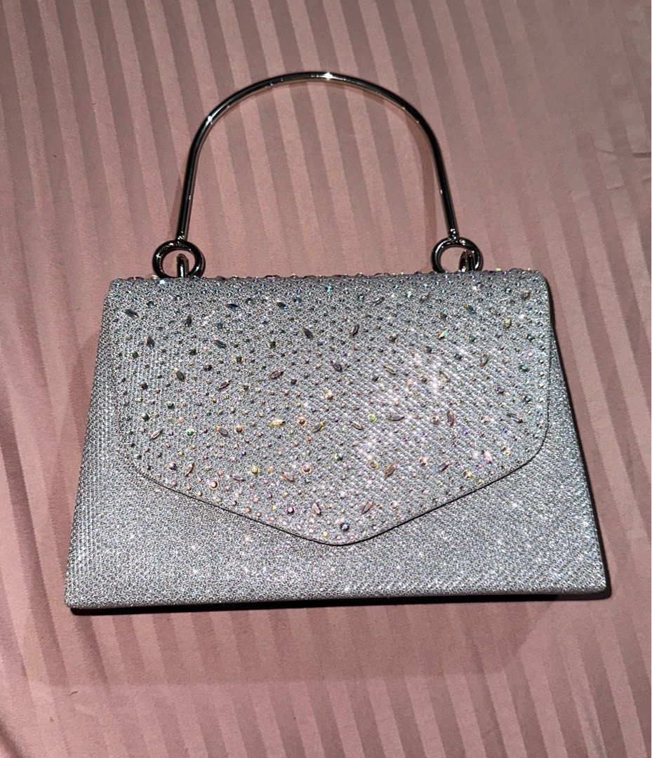 Silver bag/clutch - Jessica McClintock (Category: Clutches) located in Manila. Submitted by cltrrd (Listing ID 1330645035, Image 2). Description: Used once Like new Bought from Rustan’s for 1850.