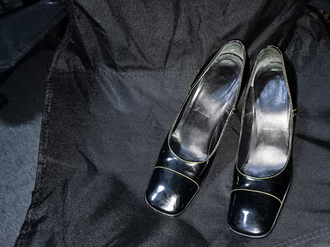 PRADA Black Leather Square Toe Cuban Heel Lackleder Pumps (Category: Heels) located in Baguio. Submitted by sapovnela (Listing ID 1330865182, Image 1). Description: +sf for the markings/current state/appearance/character/design/theme please check photos, z👁️‍🗨️👁️‍🗨️m all Ü want, as i do my best to show everything in the pictures color/s: black fabric/material: patent leather, yellow stitching detail featured style: retro vintage, comfort slip