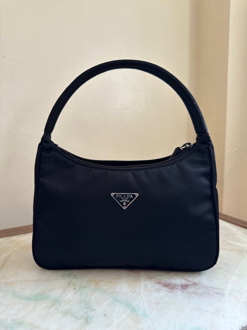 Prada Re-edition Nylon Shoulder Bag 😍 (Category: Luxury Bags & Wallets) located in Quezon City. Submitted by carou1990 (Listing ID 1330719119, Image 1). Description: Guaranteed original 💯 Bought directly from Japan auction With FREE bag organizer Shipping via LBC COD/COP For meet-up: Timog or SM North QC.