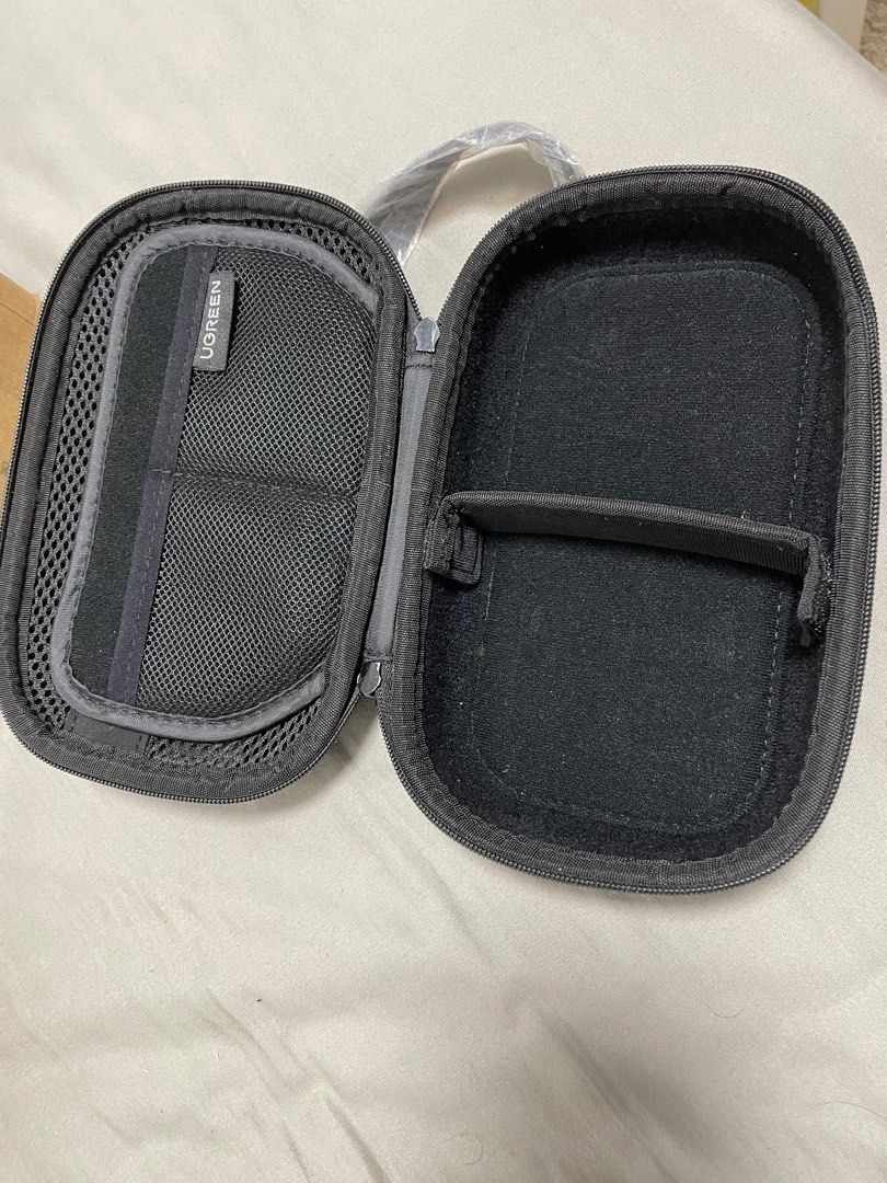Ugreen Tech Pouch (Category: Office & Business Technology) located in Singapore. Submitted by tpvt99 (Listing ID 1330833233, Image 2). Description: Very new as I used very few times. It stay in cupboard for around a year as I have not used it while travelling. No scratches and nilon protector is still on strap. I take care very much of it..