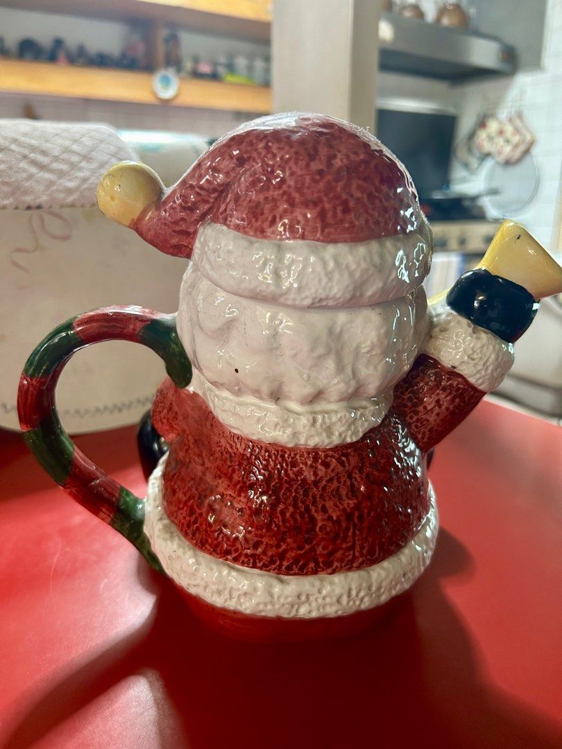 Wang’s International Santa Claus Tea Pot (Category: Coffee & Tea Tableware) located in Las Pinas. Submitted by rjmwings (Listing ID 1330776855, Image 3). Description: Wang’s International Santa Claus Tea Pot Vintage item from 1999, bought in the US 9-inches tall, made of ceramic material Used as Christmas decoration for the kitchen or dining area For the collectors of tea pots and Santa Claus figurines The item may have some signs of cosmetic wea