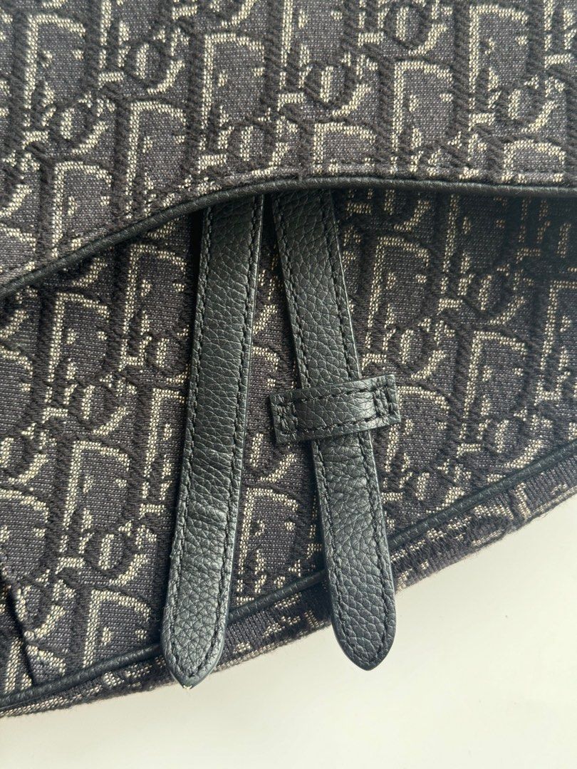 Authentic Christian Dior Men's Saddle Bag (Category: Luxury Bags & Wallets) located in San Mateo. Submitted by dailyluxemnl (Listing ID 1330958006, Image 3). Description: Top off your streetwear look with this Black Oblique Jacquard Saddle Bag! ⚠️ Condition: 10/10 Rank: Good as New (check our ranking guide in our highlights to see the description for our ranks) Material: Canvas Inclusions: Box, Receipt, Original Dust Bag, Cards.