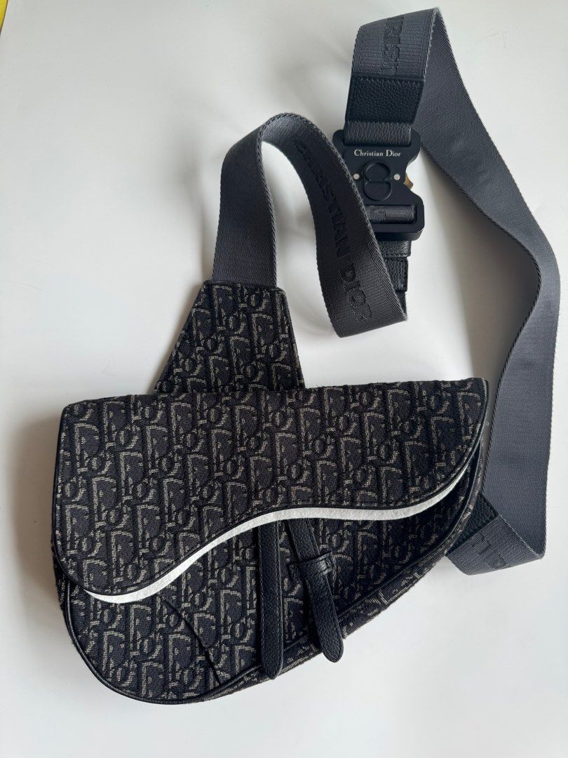 Authentic Christian Dior Men's Saddle Bag (Category: Luxury Bags & Wallets) located in San Mateo. Submitted by dailyluxemnl (Listing ID 1330958006, Image 1). Description: Top off your streetwear look with this Black Oblique Jacquard Saddle Bag! ⚠️ Condition: 10/10 Rank: Good as New (check our ranking guide in our highlights to see the description for our ranks) Material: Canvas Inclusions: Box, Receipt, Original Dust Bag, Cards.